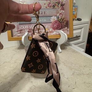 Vegan leather compact mirror keychain/bag charm in popular design.